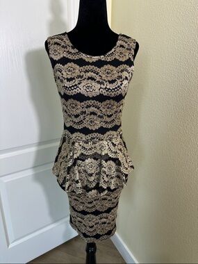 Black and Gold Lace Peplum Sheath Dress. By Alt.B. Size medium.